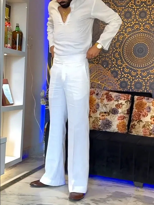 White three-piece women's outfit with V-neck shirt, sleeveless vest, and full-length trousers