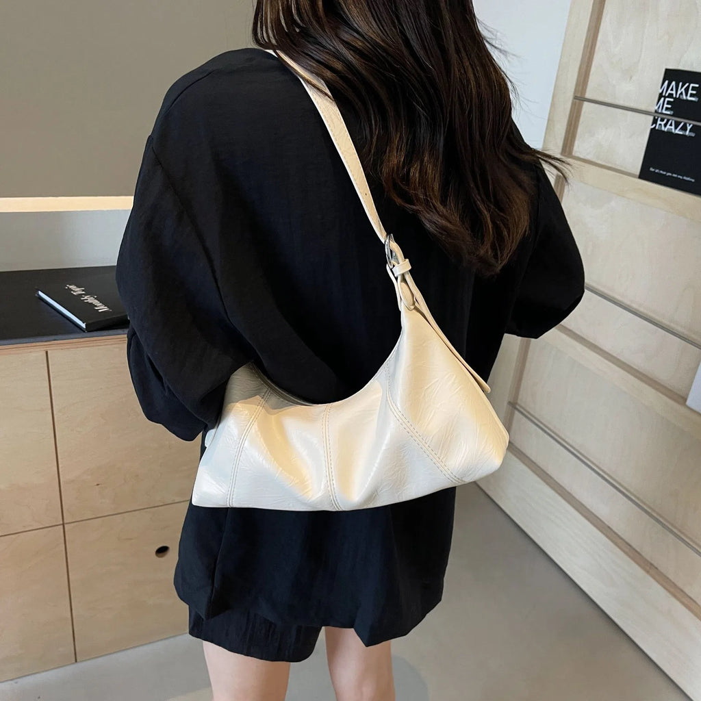 New women's crossbody bag in beige, soft PU material with stitching detail and double shoulder straps