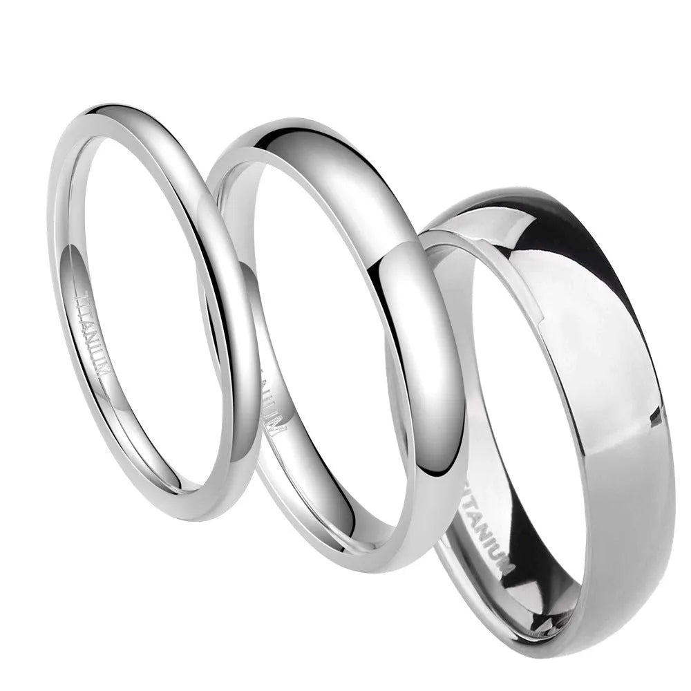 Polished silver titanium ring showing different width options on a finger.