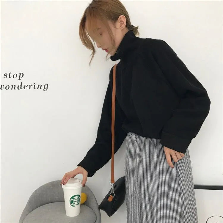 Women's solid colour long-sleeve top with a half-high collar in a loose fit.