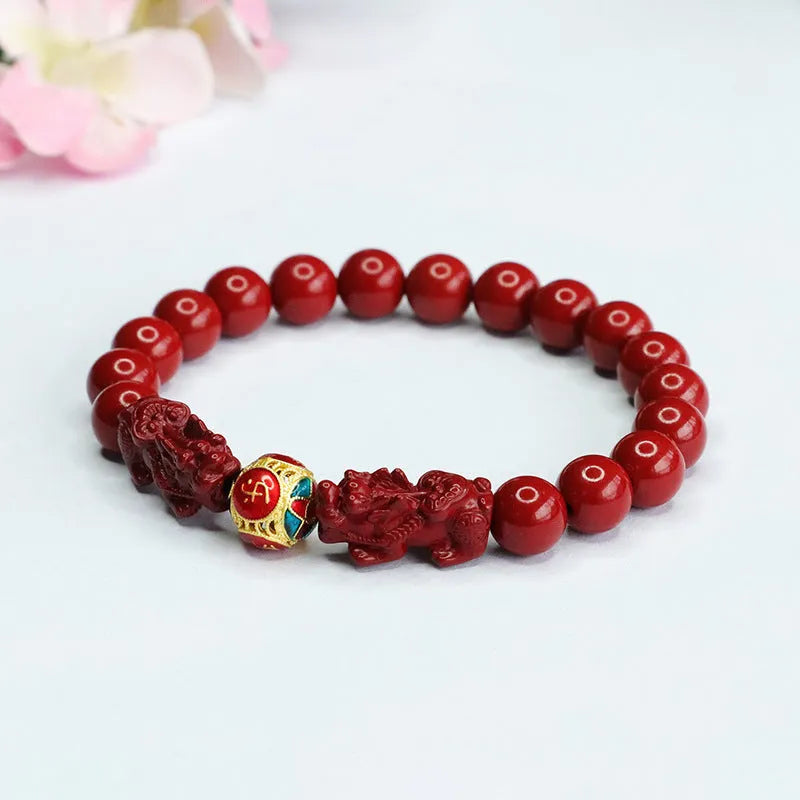 Close-up of a purple gold sand Cinnabar bracelet with carved Double Pixiu design, bead size 8mm.