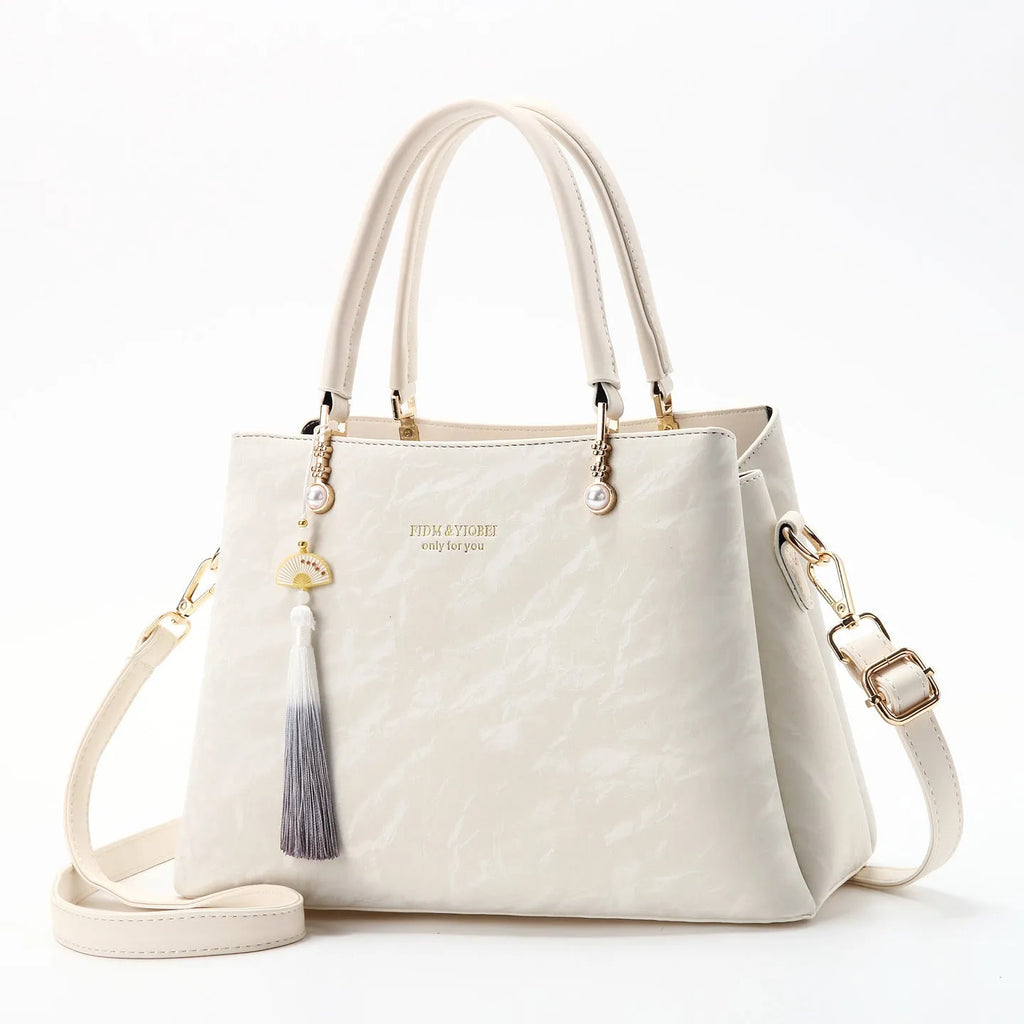 Women's PU leather shoulder bag with horizontal square shape and slit pockets in ethnic-style finish