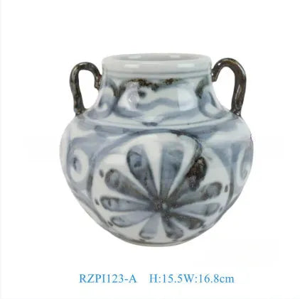 Hand-painted sunflower blue and white ceramic vase on a wooden table