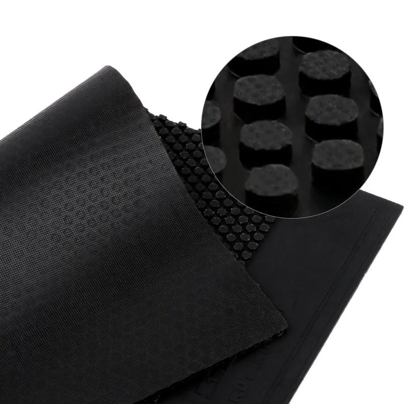 Single sheet of black and red raw table tennis rubber with a small particle surface.