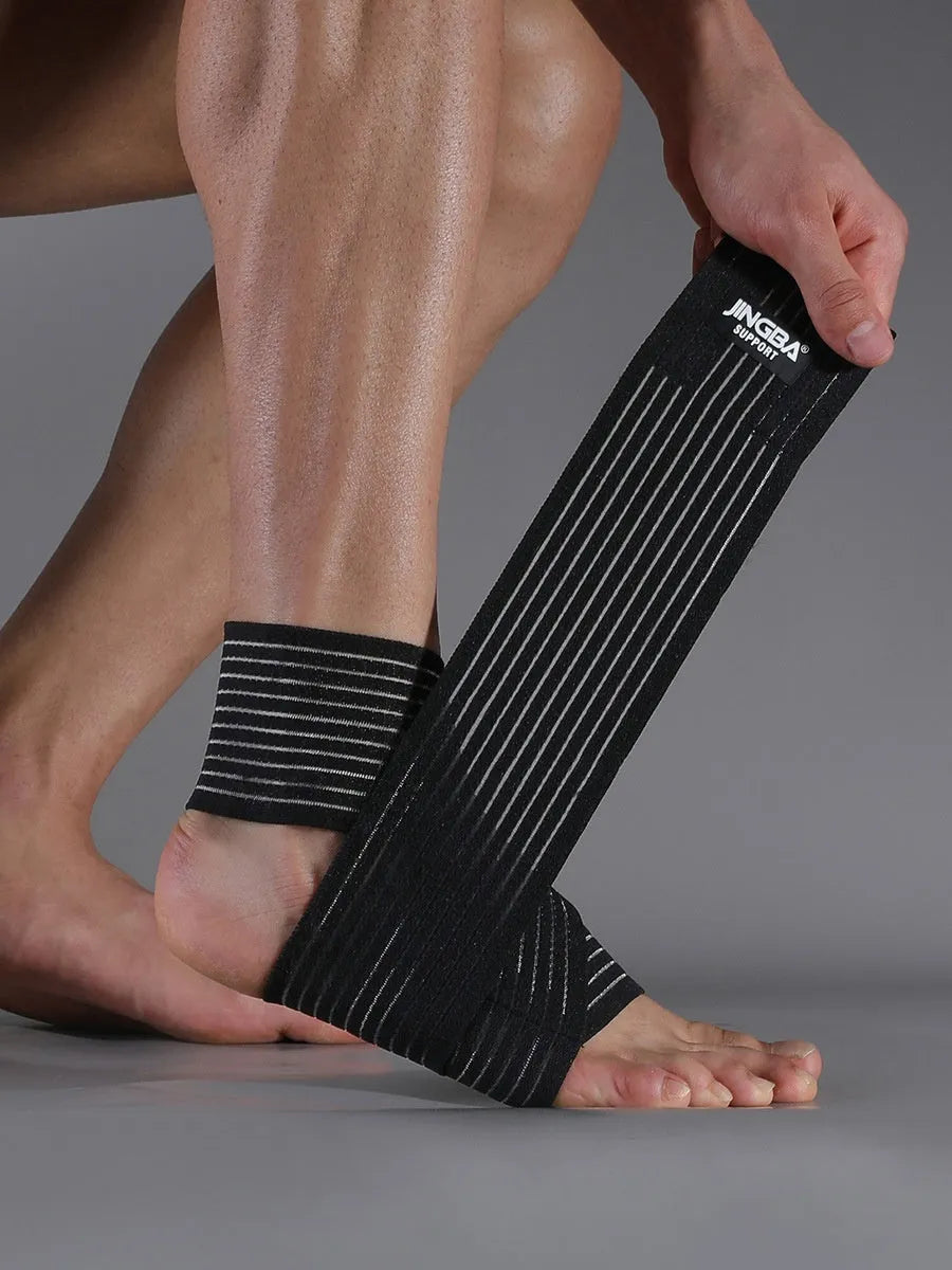 Black adjustable sports ankle support bandage wrapped around a joint