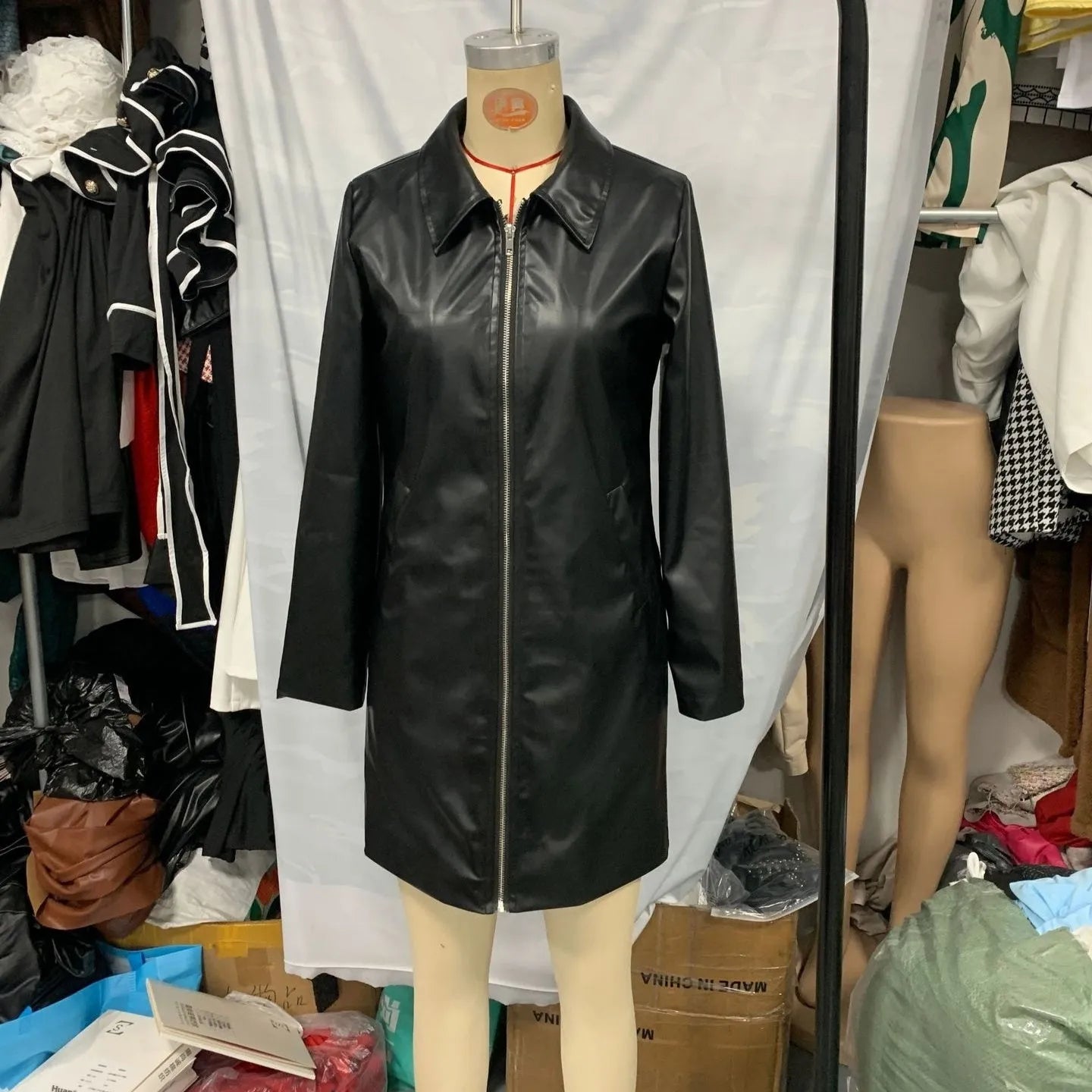 Women's black leather jacket with medium length and long sleeves for casual wear