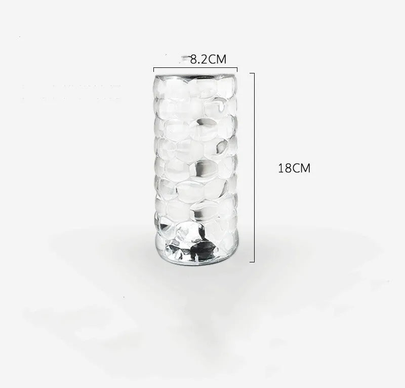Crystal table lamp rechargeable with teardrop acrylic shade showing droplet shadow effect on a bedside table