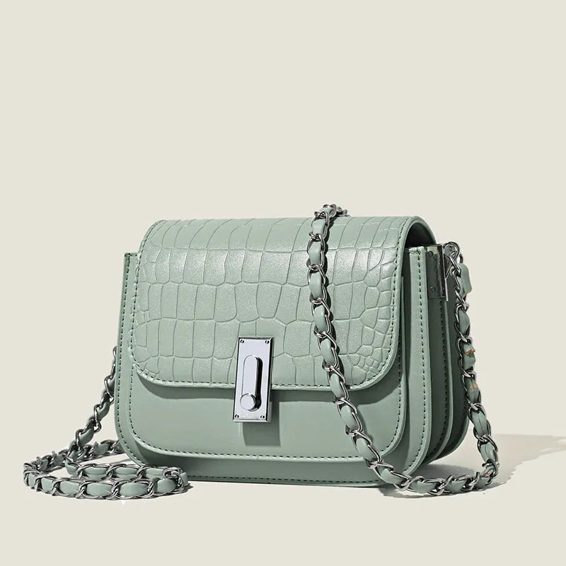 Women's black soft PU chain shoulder bag with square shape and cross-body strap.