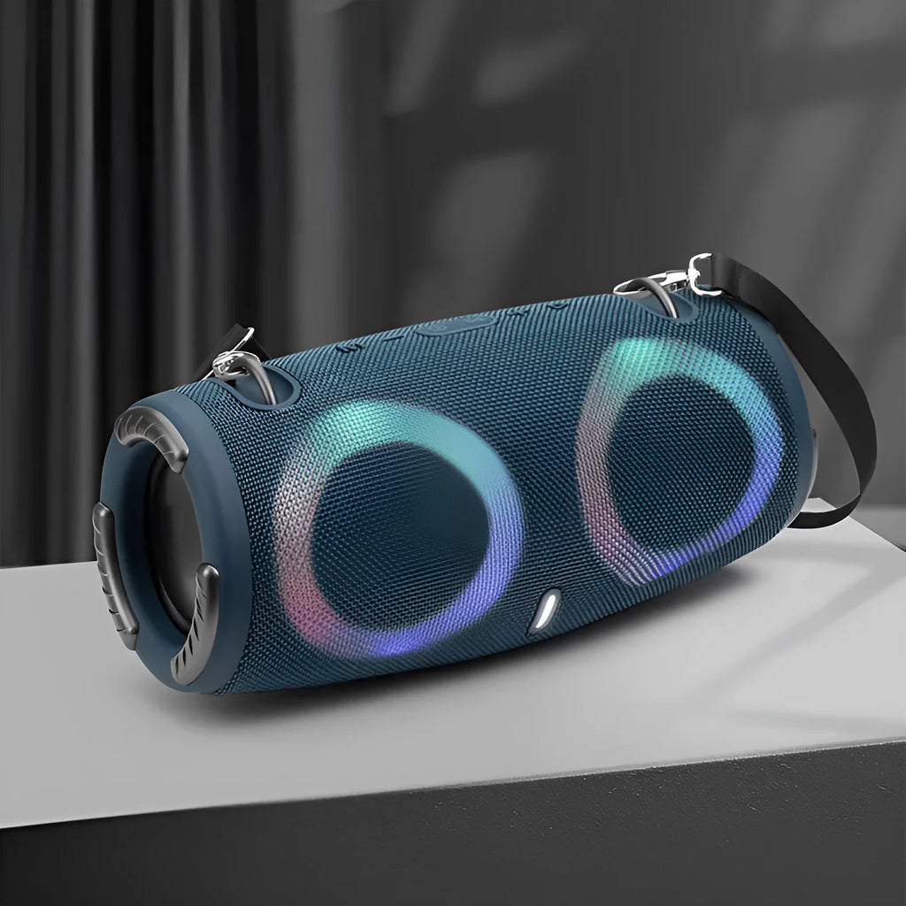 War Drum portable Bluetooth speaker with coloured LED lights in a black finish, showing carrying strap and control buttons.