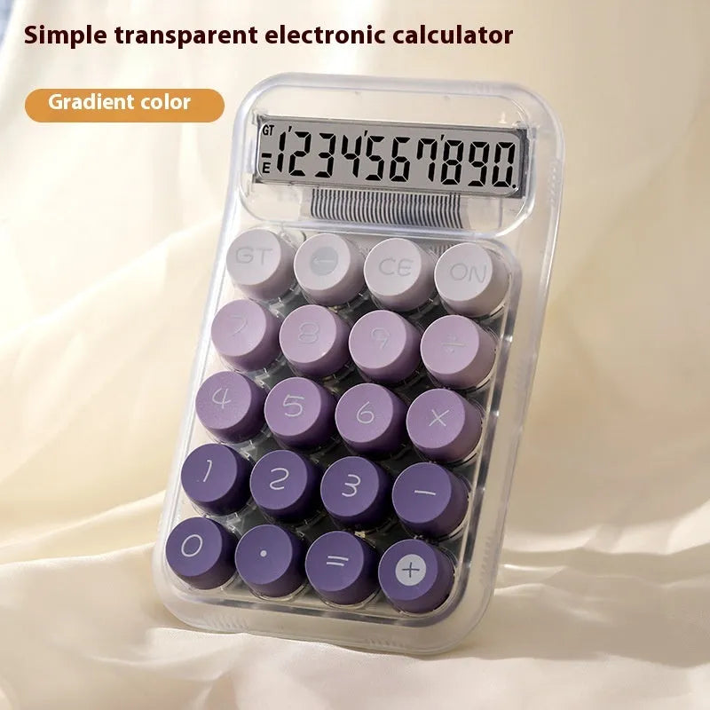 Round gradient colour mechanical keyboard calculator in mute blue, green, pink, or purple on a desk.