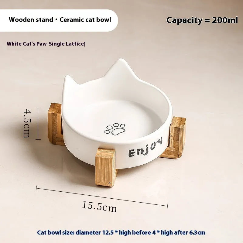 Porcelain cat bowl with cat ear and paw design on a wooden feeding frame, in pink colour.