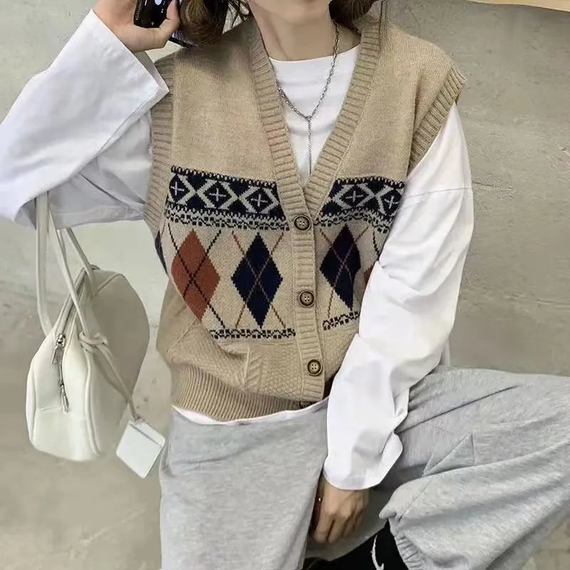 Khaki diamond plaid sleeveless loose cardigan top on a hanger