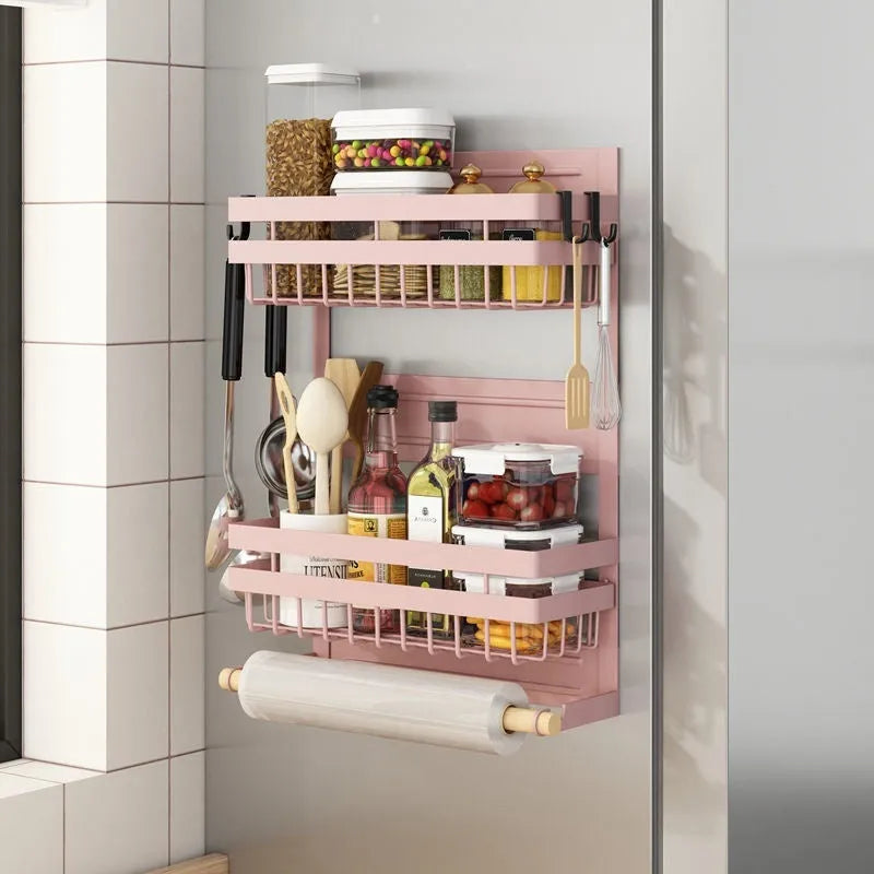 Black magnetic metal refrigerator side storage rack holding a tissue roll and a seasoning bottle