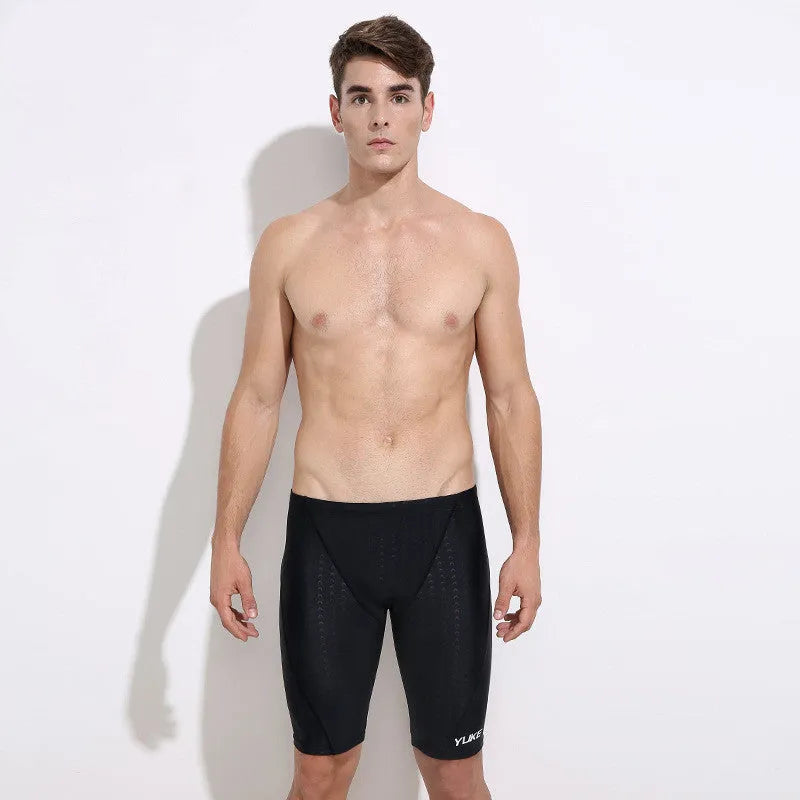 Men's black 5-piece swimming set showing swimming trunks, goggles, cap, ear plugs with nose clip, and carrying bag