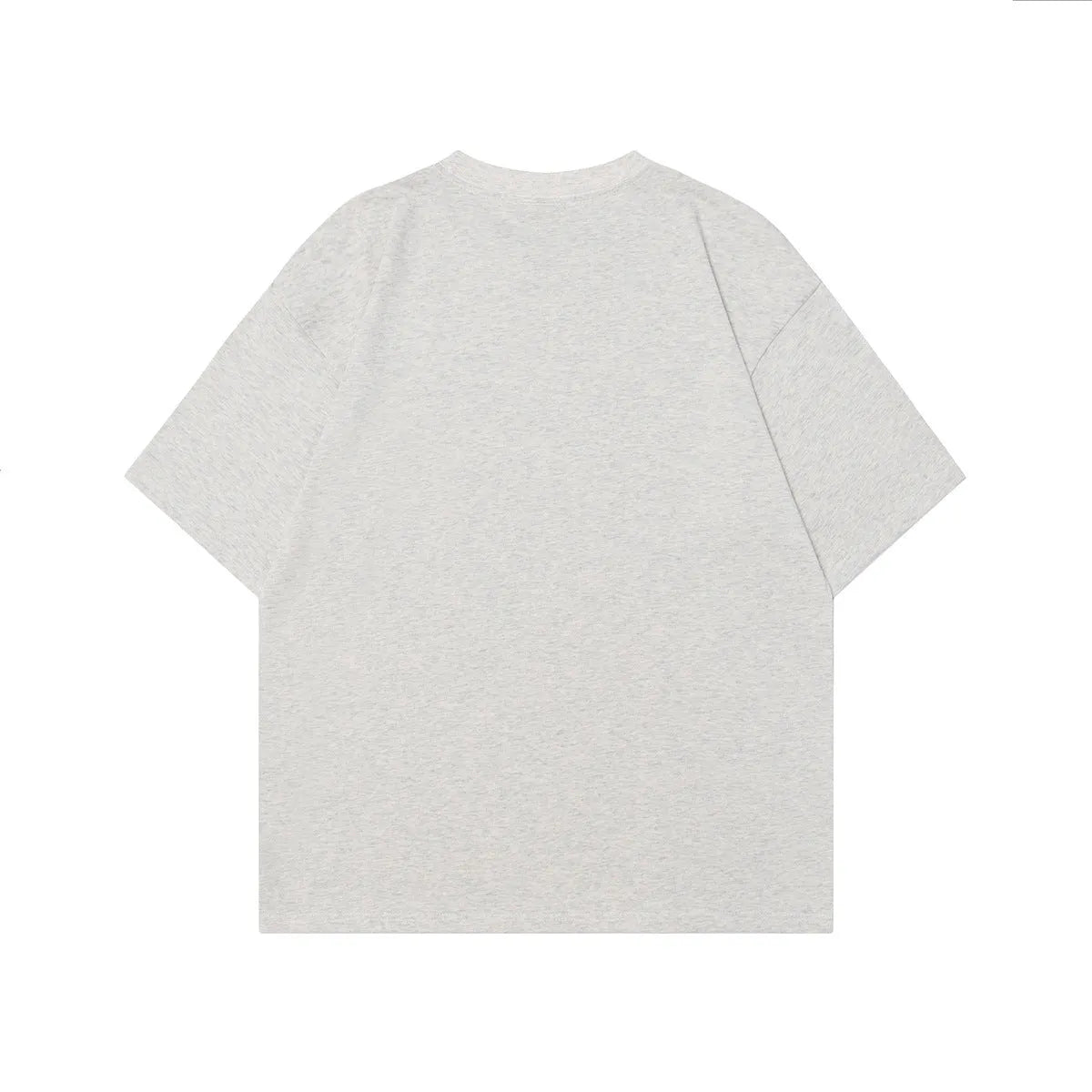 Men's grey loose-fit cotton t-shirt featuring a retro character design print on the chest.