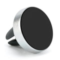 Car magnetic phone holder clipped onto dashboard air vent in rose gold colour, showing compact size.