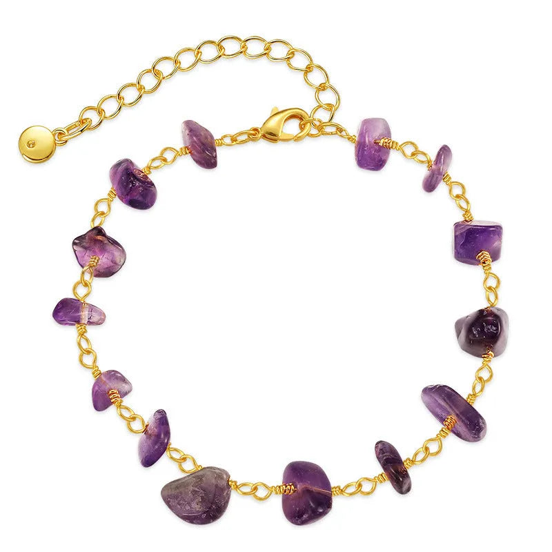 Geometric women's copper bracelet with irregular turquoise gravel stones and crystal accents on a white background.