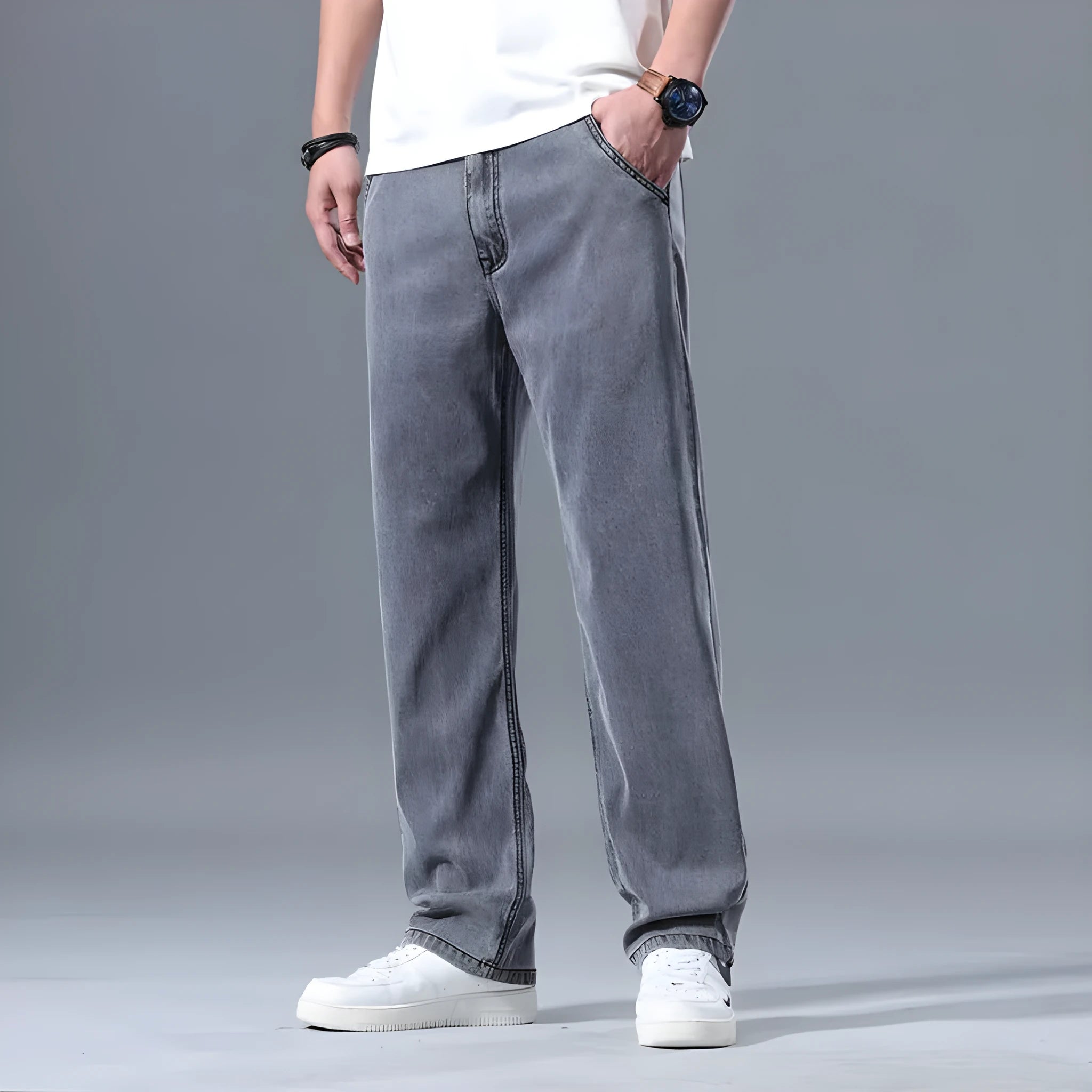 Men's loose straight-leg lyocell jeans in blue and grey colour options showing zip fly detail