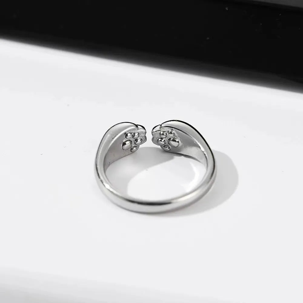 Cute kitten paw print ring in alloy with electroplated finish, unisex cartoon animal style