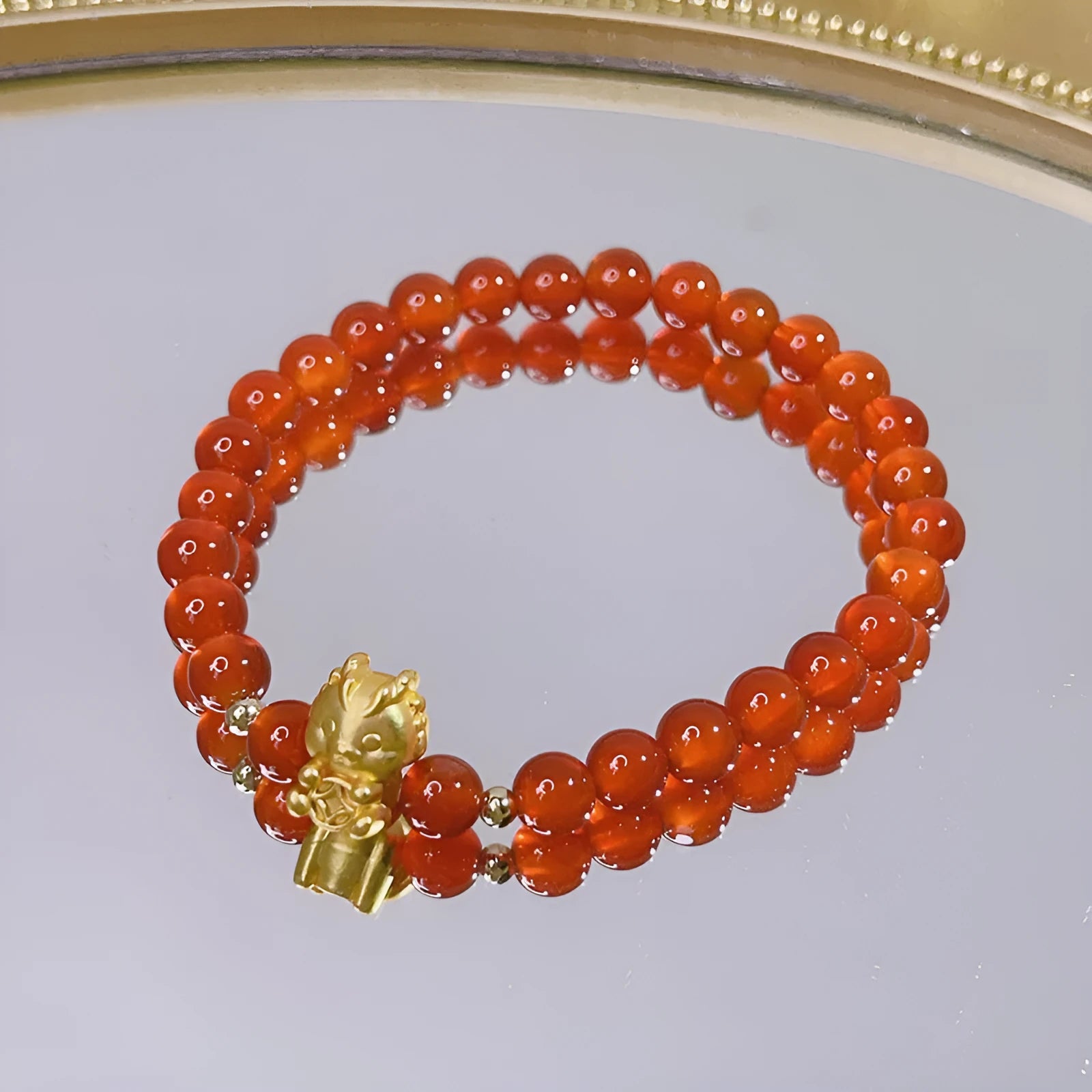 Handmade red agate bracelet with dragon design for women, Chinese style.