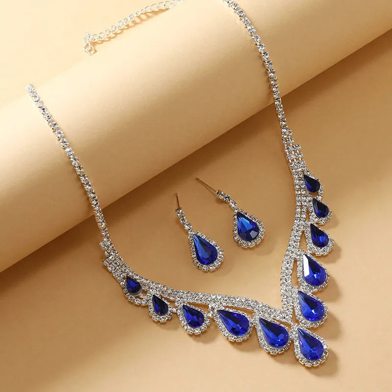 Sapphire blue alloy clavicle chain necklace and earrings set in Royal Blue White K finish on display