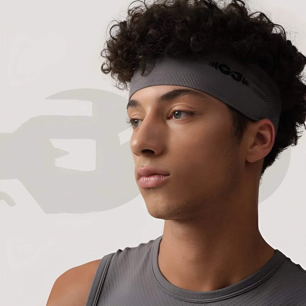 Seamless knitted exercise hair band in black, grey, and blue for sports.