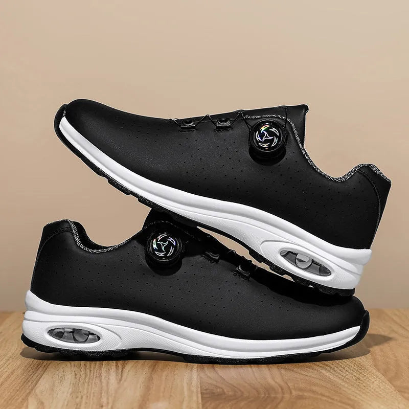 Black and white low-top men's tennis shoes with mesh upper and cross shoulder straps