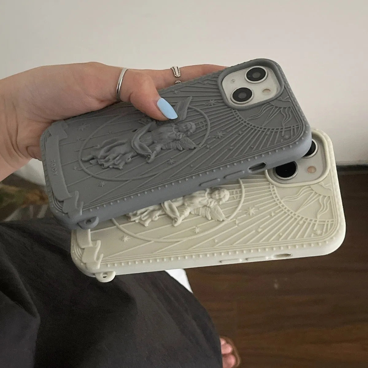 Silicone phone case with embossed Statue of Liberty design, available in beige or gray, for iPhone 11 to 16
