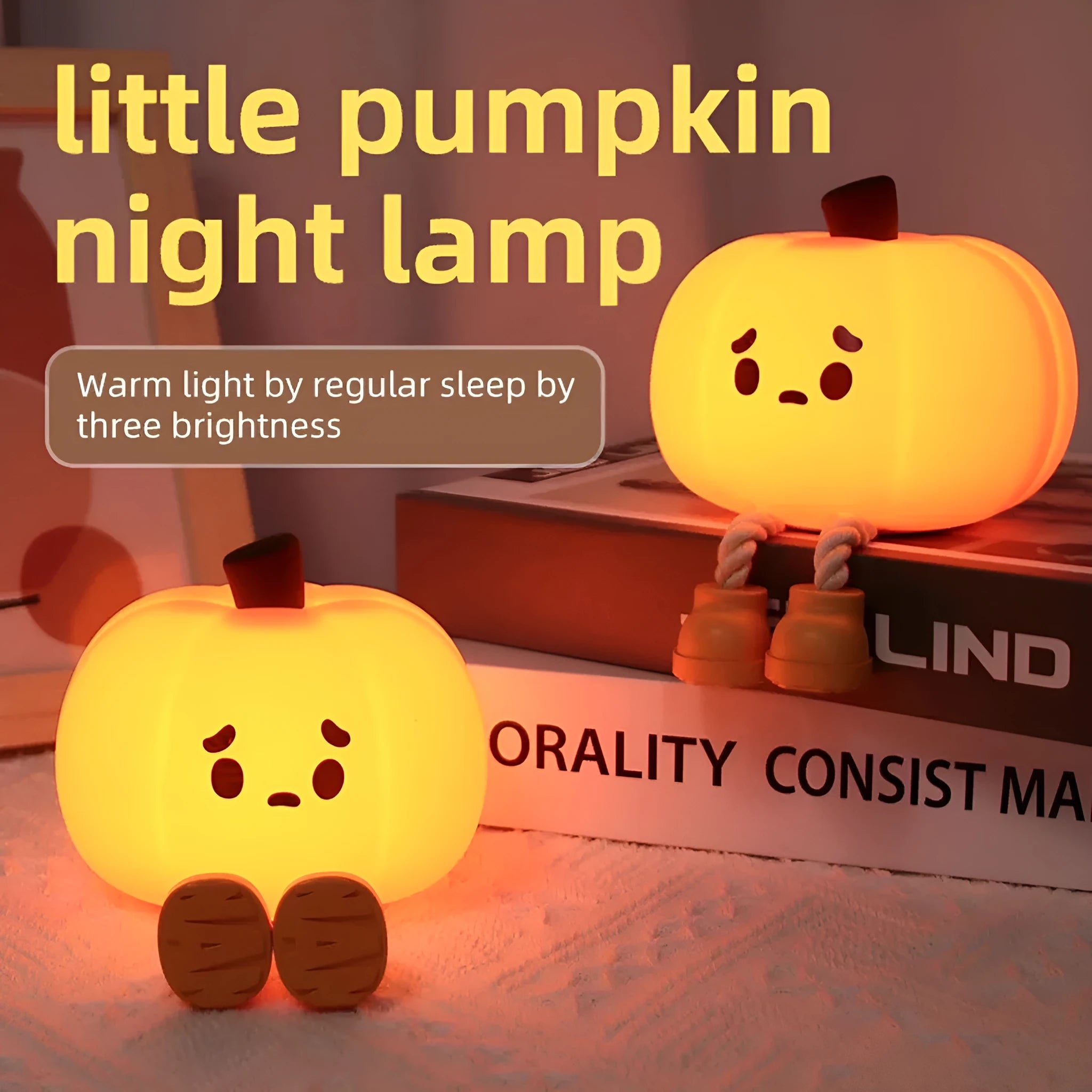 Pumpkin-shaped silicone night light with rechargeable battery on a bedside table