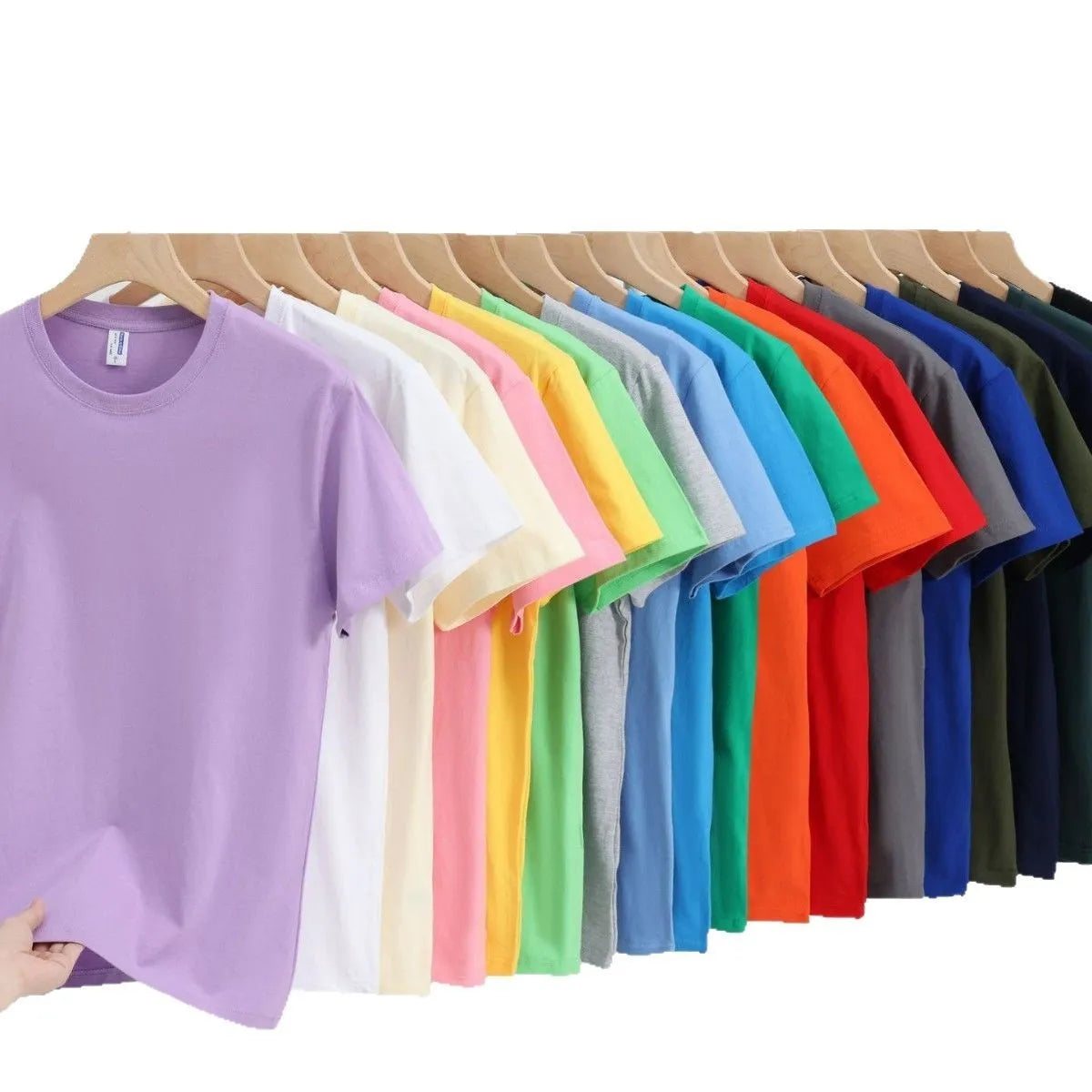A loose-fit, thick cotton T-shirt in a solid colour, shown on a hanger.