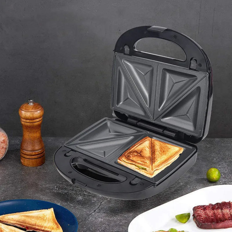 Black electric sandwich maker with double-sided heating, brushed stainless steel lid, and non-stick plates.