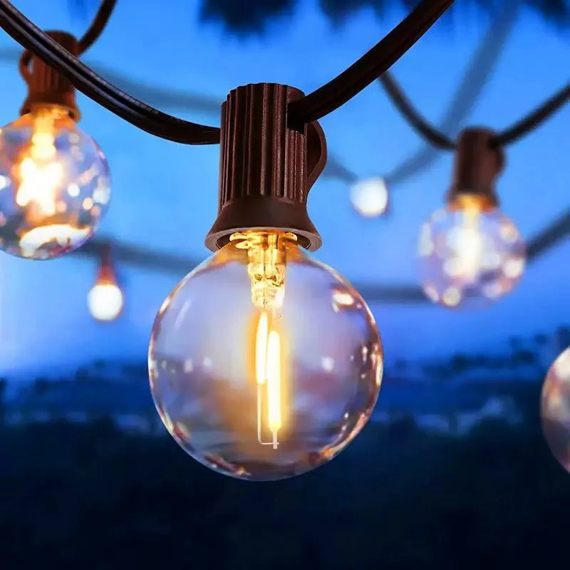 Outdoor waterproof LED lighting chain with warm light, plastic shell, IP44 rating, available in 7.5m, 16.5m, and 26.5m lengths.