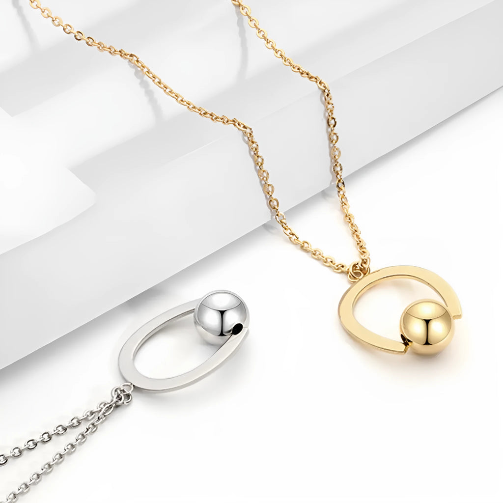 Adjustable stainless steel necklace with geometric pendant on a cross chain, shown in gold colour.