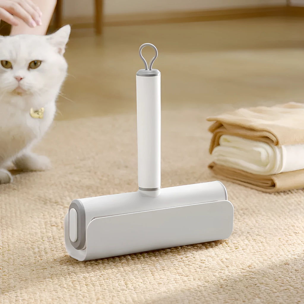 Floor lint remover roller tool for pet hair and dust removal with refillable adhesive roller core.