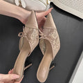 Women's light brown high heels with a pointed toe, decorative bowknot, and mesh upper.