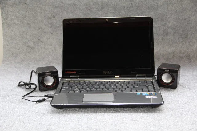 A small black square USB-powered 2.0 speaker for 700B computer systems.