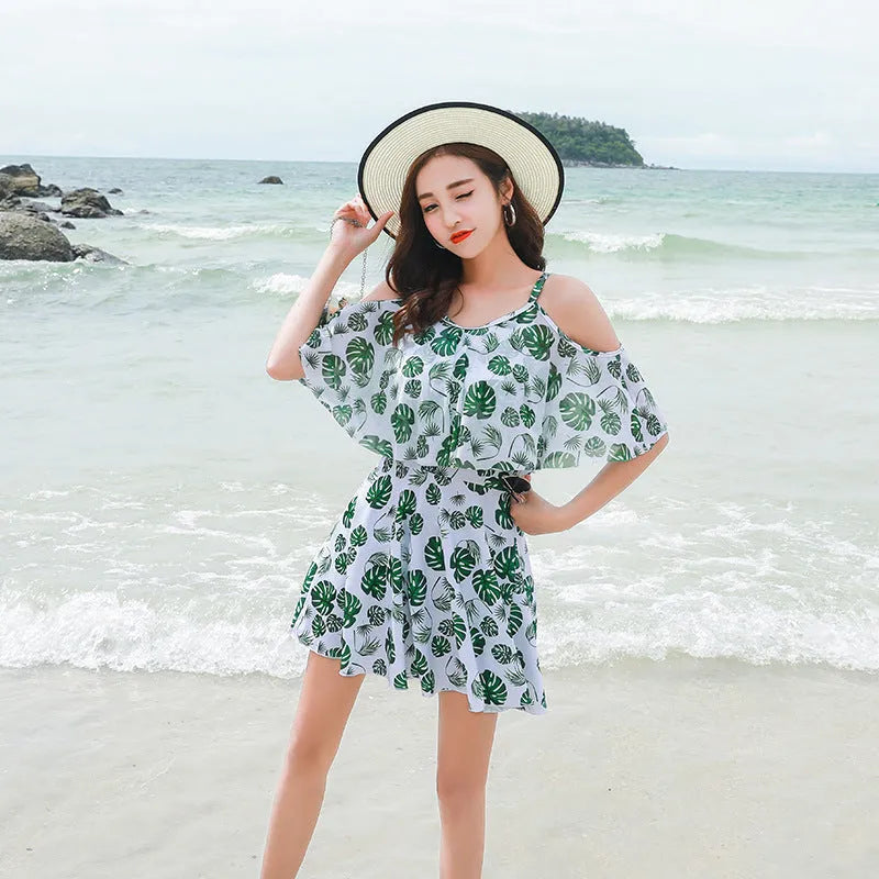 Women's printed one-piece swimsuit in polyester fabric showing green leaf style and black letter style colour options