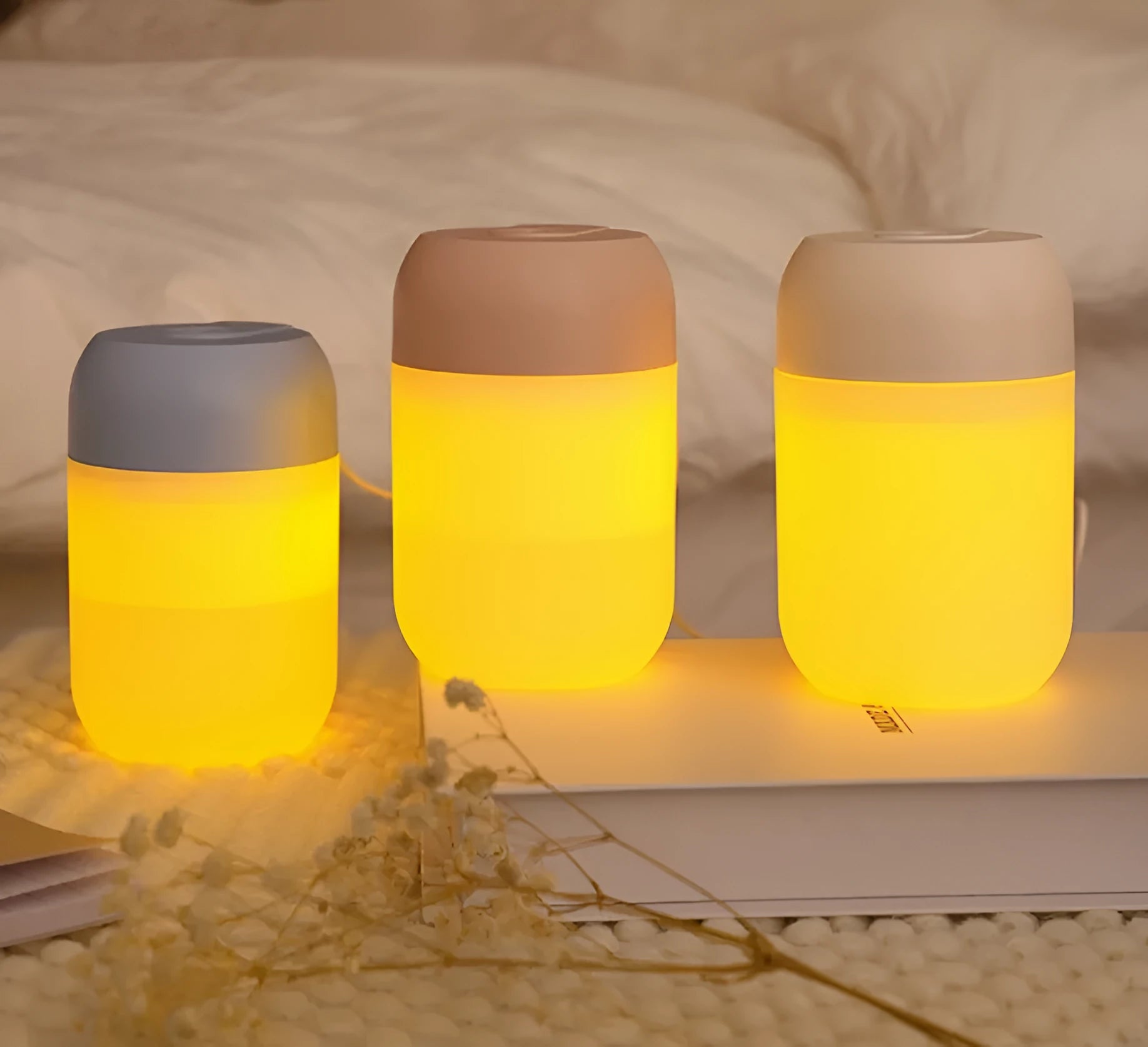 Small white cylindrical USB-powered personal humidifier on a desk.