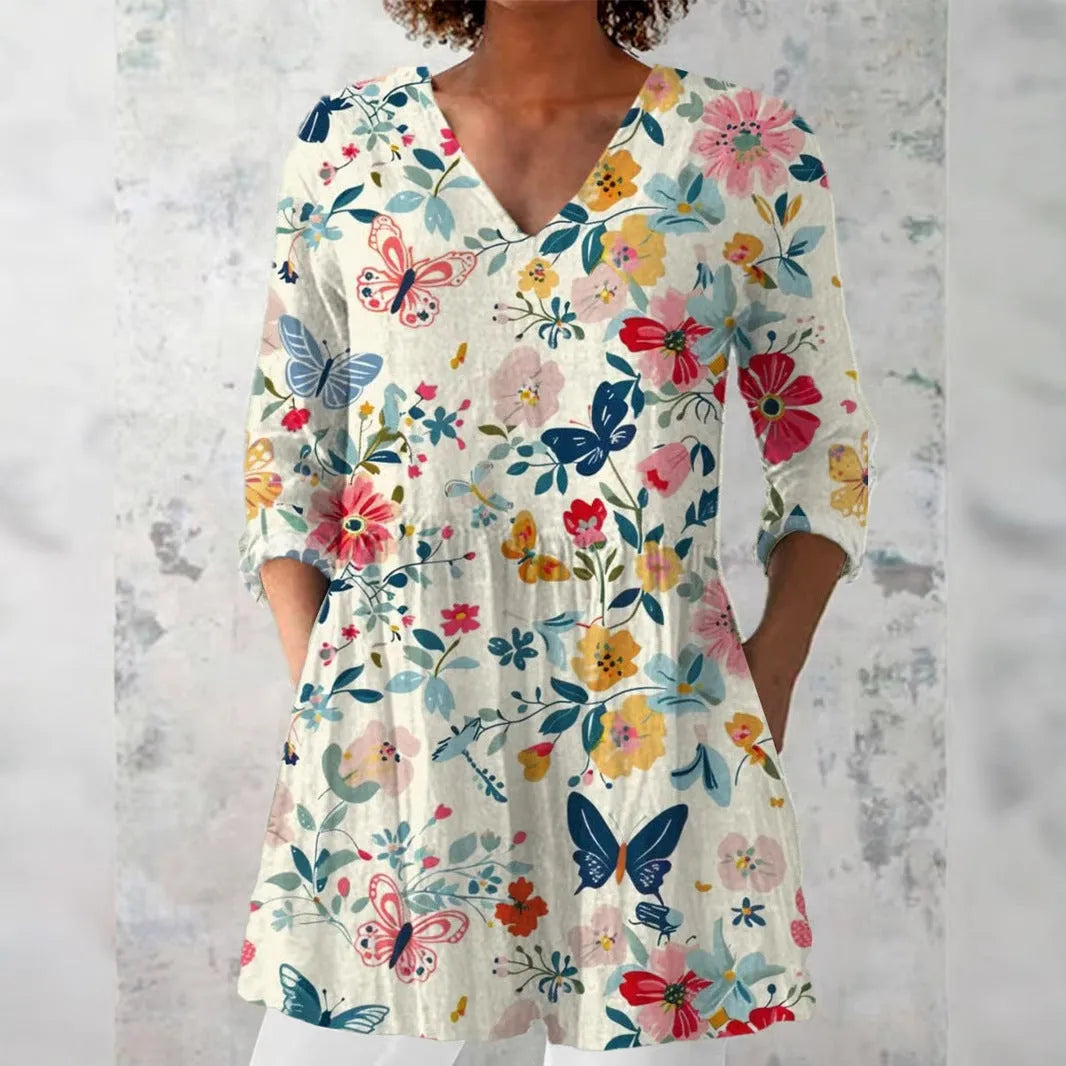 Women's retro patterned long-sleeved top with V-neck on a hanger