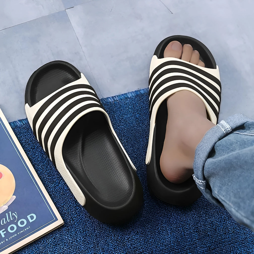 Unisex casual slippers with PVC upper and EVA sole in beige, shown on a white background.