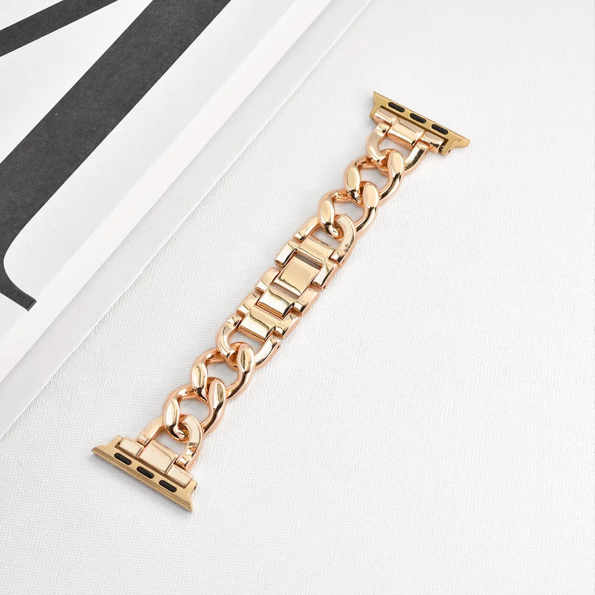 Metal denim chain Apple Watch strap in silver, black, gold, rose gold, and Starlight colours showing textured design