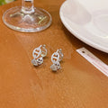 Ladies diamond design earrings in silver, gold, or rose gold finishes with thick gold plating on copper