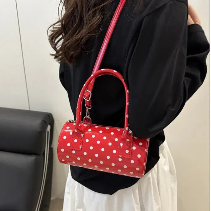 Korean-style PU leather tote pillow bag in black, white, and red colours, cylindrical shape with stitched seams and single shoulder strap, 20x10x10cm