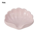 White or pink plastic shell-shaped soap dish for bathroom organisation