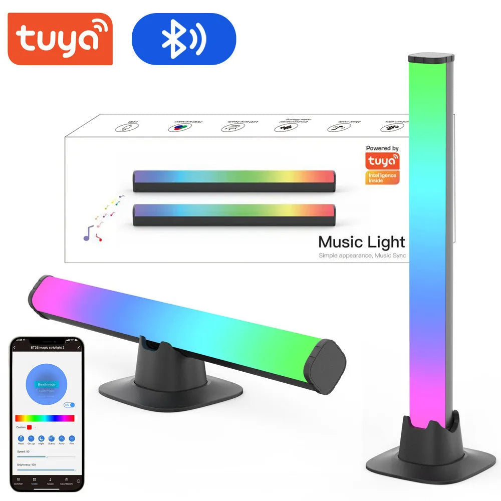 Two black desktop atmosphere lights with USB cables and app control interface on a gaming desk