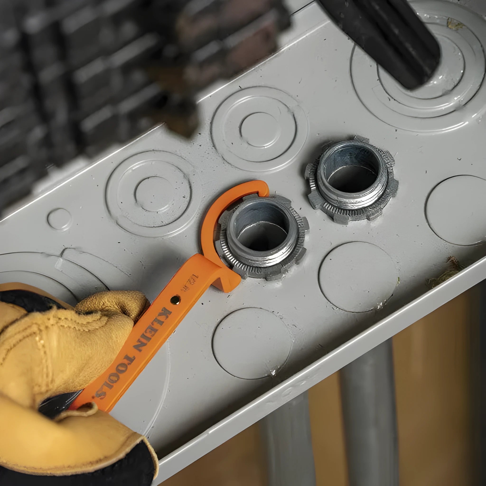 Three magnetic crescent wrenches in orange, grey, and black with locking mechanism and suction feature