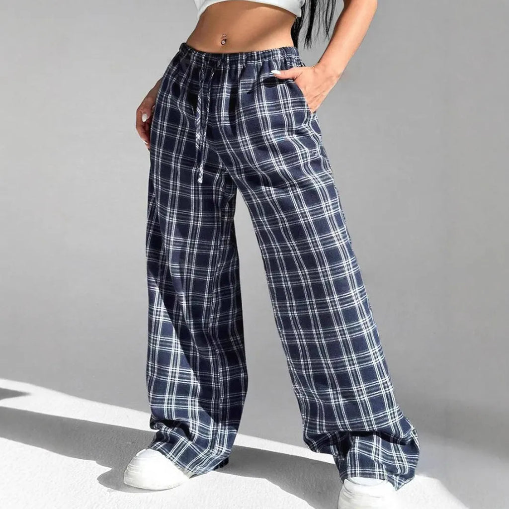 Women's red casual loose trousers with drawstring waist and plaid pockets on mannequin
