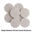Assortment of beige round and square plastic non-slip furniture foot pads on a wooden floor.