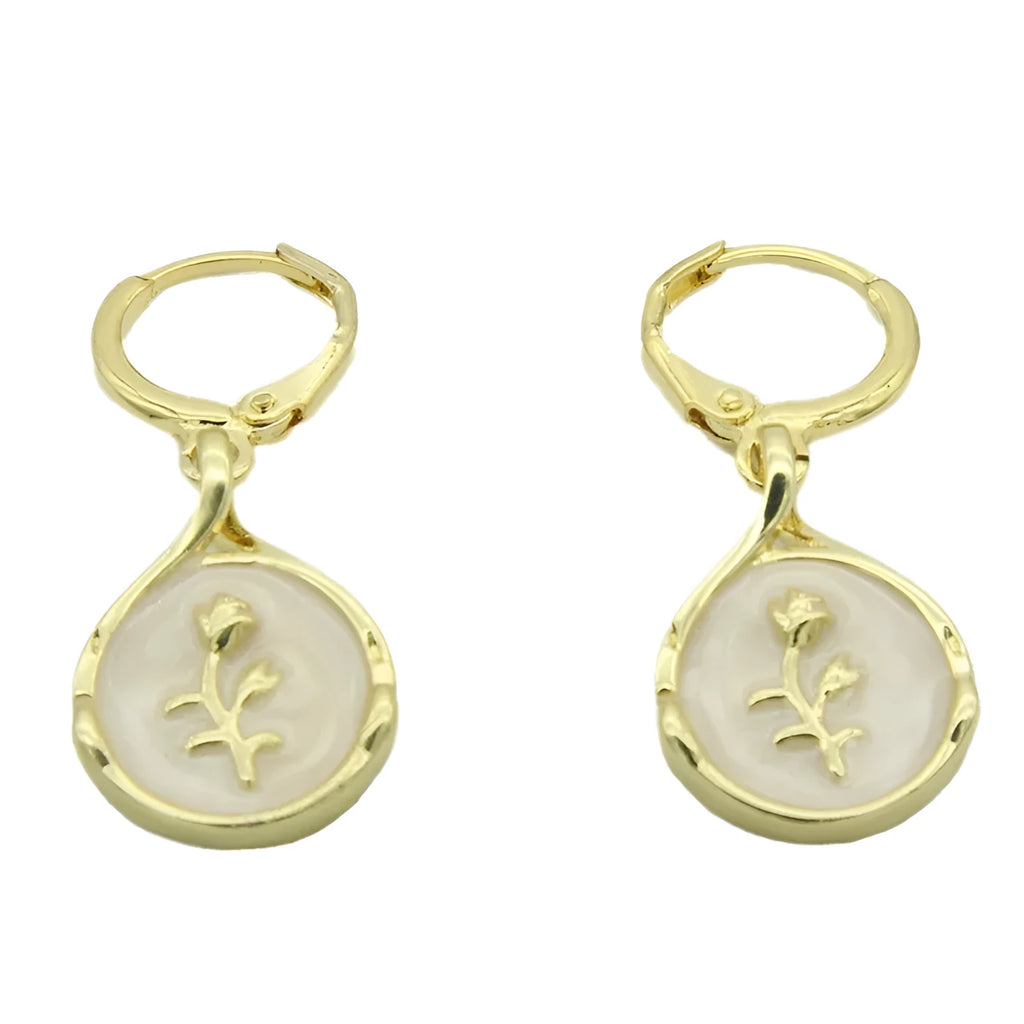 Drop-shaped brass earrings with rose inlay and zircon stones in a teardrop silhouette