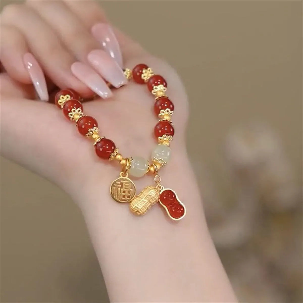 Handmade unisex glass beaded bracelet with rabbit charm on elastic cord.